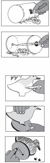 Drawing of inserting bells into round oat meal box and then inserting a pencil with a string attached.